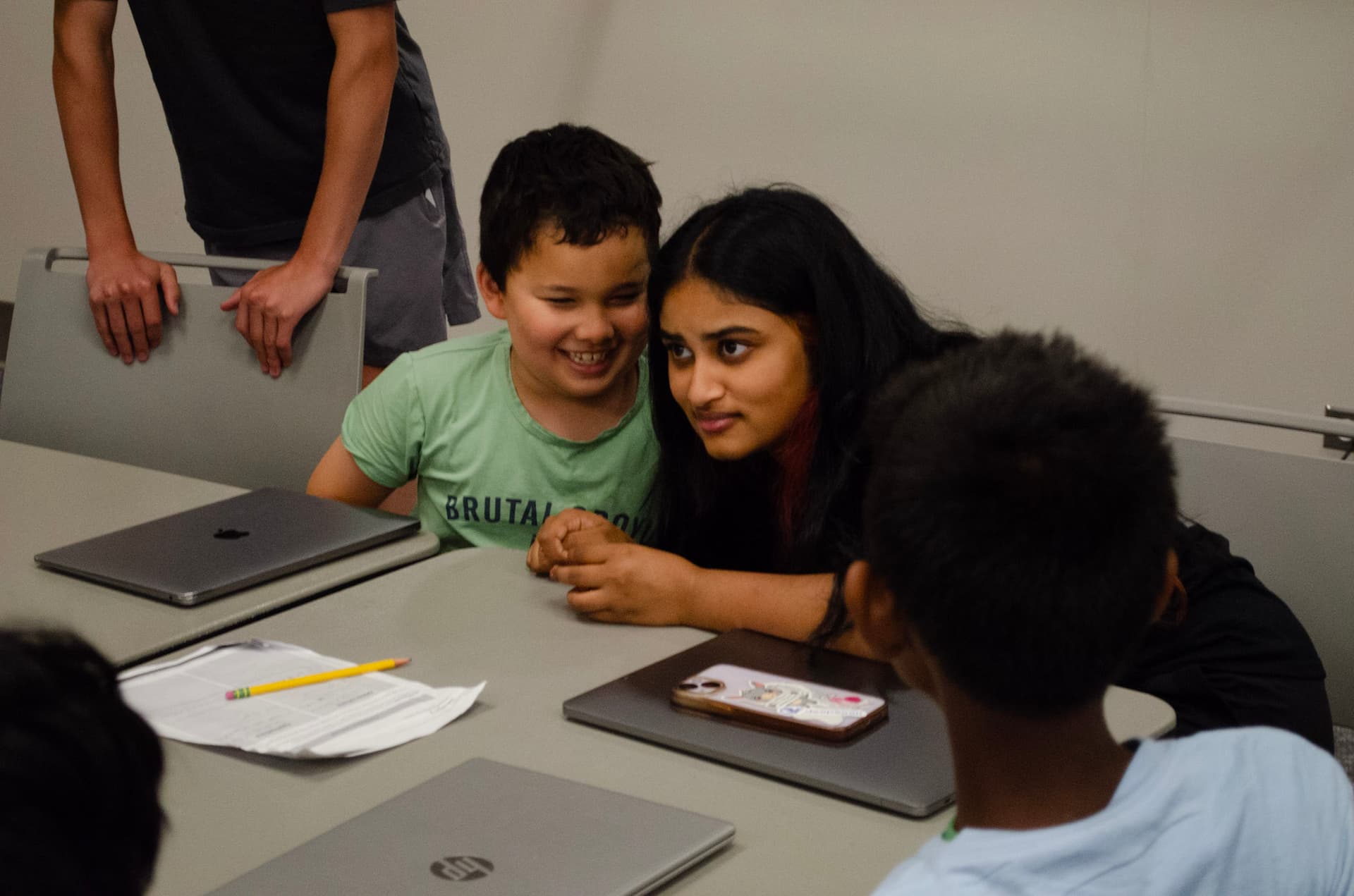 A BizBuzz instructor working one-on-one with a VentureLab student